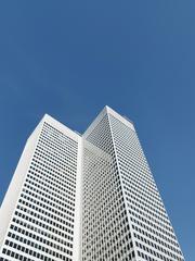 White high-rise building under blue sky in Golden Square Mile Montreal