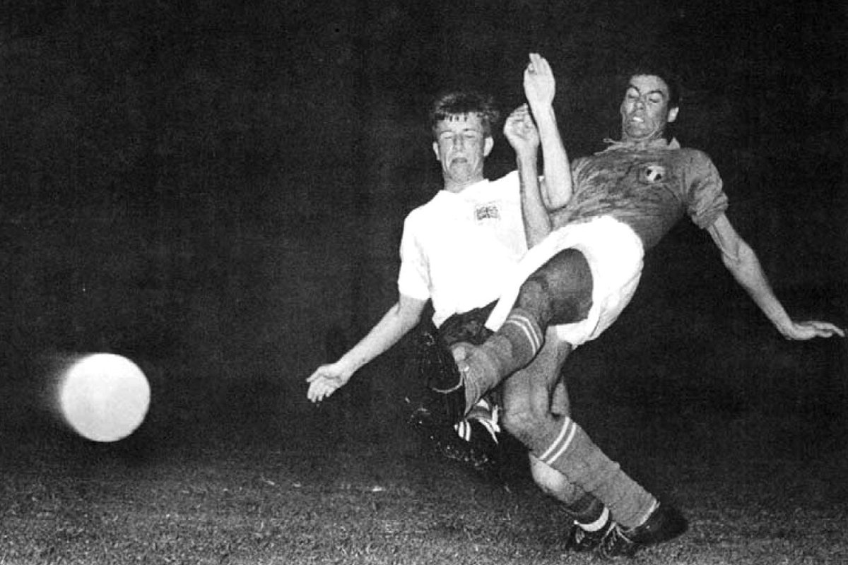 Italy's Sandro Salvadore tackles British player Bobby Brown during football match between Italy and Great Britain at 1960 Rome Olympics