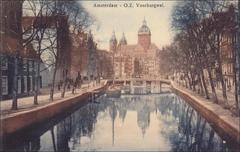 Black and white postcard image of Amsterdam street Voorburgwal, dated before 1920s