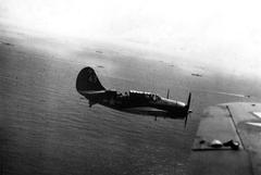 U.S. Navy Curtiss SB2C-3 Helldiver of Bombing Squadron 18 in flight over Task Group 38.2 during the Battle of the Sibuyan Sea on October 24, 1944