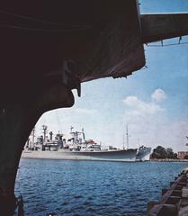 Retired U.S. Navy cruisers USS Newport News, USS Springfield, and USS Northampton in mothball storage at Philadelphia Naval Shipyard in 1978 with USS Intrepid bow in foreground