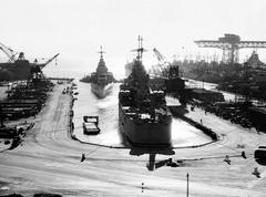 USS Bremerton and USS Los Angeles heavy cruisers towed from San Francisco Naval Shipyard drydock on February 13, 1948
