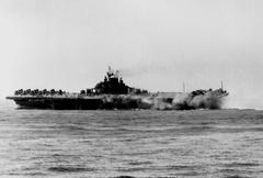 USS Intrepid CV-11 listing after kamikaze attack in Pacific 1945