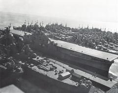 USS Intrepid (CV-11) aircraft carrier mothballed at San Francisco circa 1950 with USS Iowa (BB-61) battleship in foreground and Cleveland-class light cruisers in background