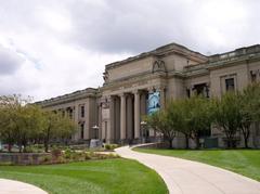 Missouri History Museum building in St. Louis with glass facade and forest park surroundings