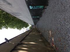 Stone pathway and wall of Prison Montluc in Lyon with exhibition commemorating 'Morts pour la France'