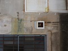 Anthropometric inscription and electric meter at Prison Montluc in Lyon 3rd arrondissement
