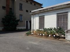 Entrance gate of Montluc prison in Lyon with memorial plaques
