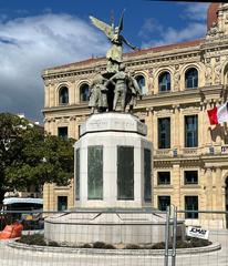 Monument aux morts de Cannes in April 2023 with flowers and memorial plaques