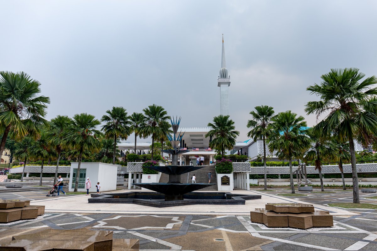 Entrance to the National Mosque of Malaysia with intricate Islamic architectural design