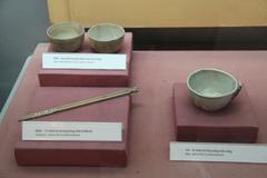 Bowls, cup, and chopsticks used by prisoners of the French at Hoa Lo Prison