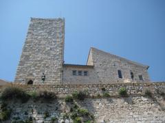 Exterior view of Musee Picasso Antibes with stone walls and blue sky