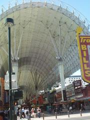 Fremont Street in Las Vegas during daytime with shops and pedestrians