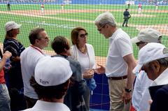 U.S. Secretary of State John Kerry speaking with House Minority Leader Nancy Pelosi at Estadio Latinoamericano in Havana Cuba