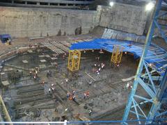 Construction site in Eurasia with heavy machinery and excavators