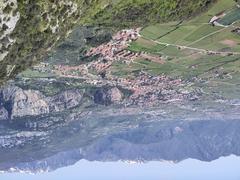 View of Arco town with surrounding mountains and Arco castle ruins