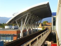 The Hub overhang structure at Broadway Station with metal framework and glass panels