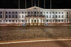 Helsinki City Hall illuminated at night with clear sky