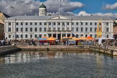 Helsinki City Hall building with classical architecture under a clear blue sky