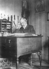 Zacharias Topelius sitting behind his desk
