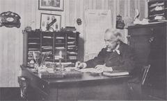 Zacharias Topelius sitting at his desk
