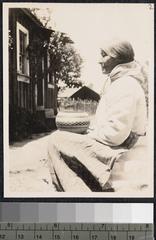 Sarah Knight, a Pomo woman, holding a traditional shuwetge basket in Ukiah, California, 1908