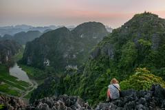 Scenic view of Hang Mua Cave with limestone karst formations and lush green landscape in Ninh Bình, Vietnam