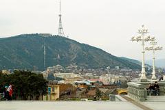 Panoramic view of Tbilisi cityscape with Mtatsminda mountain in the background