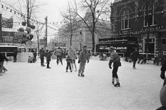 Outdoor artificial ice rink Het Leidsepleintje in Amsterdam covered with snow during persistent frost and winter weather in 1981