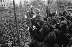 Ajax football player Barry Hulshoff holding the European Cup on the balcony of Stadsschouwburg in Amsterdam in 1972