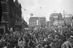 Ajax football players on balcony cheered by huge crowd in Amsterdam