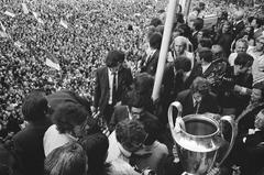 Ajax football players on a balcony being cheered by a huge crowd in Amsterdam in 1971