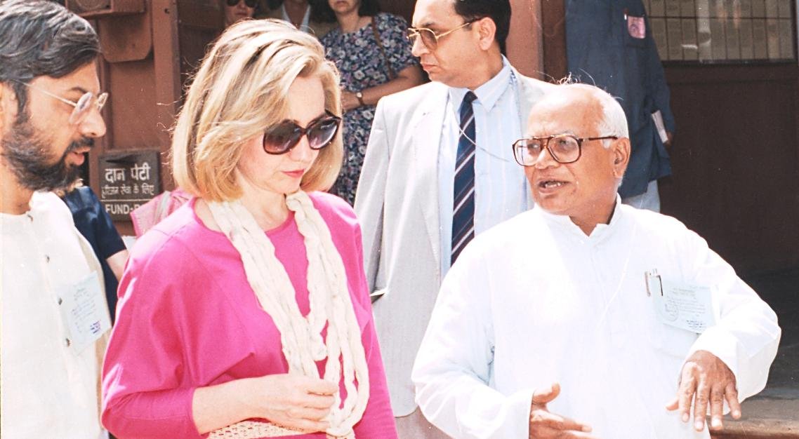 Entrance gate of Sabarmati Ashram with people walking