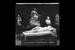 Vintage black and white photograph of a woman resting in Luxembourg Garden, Paris