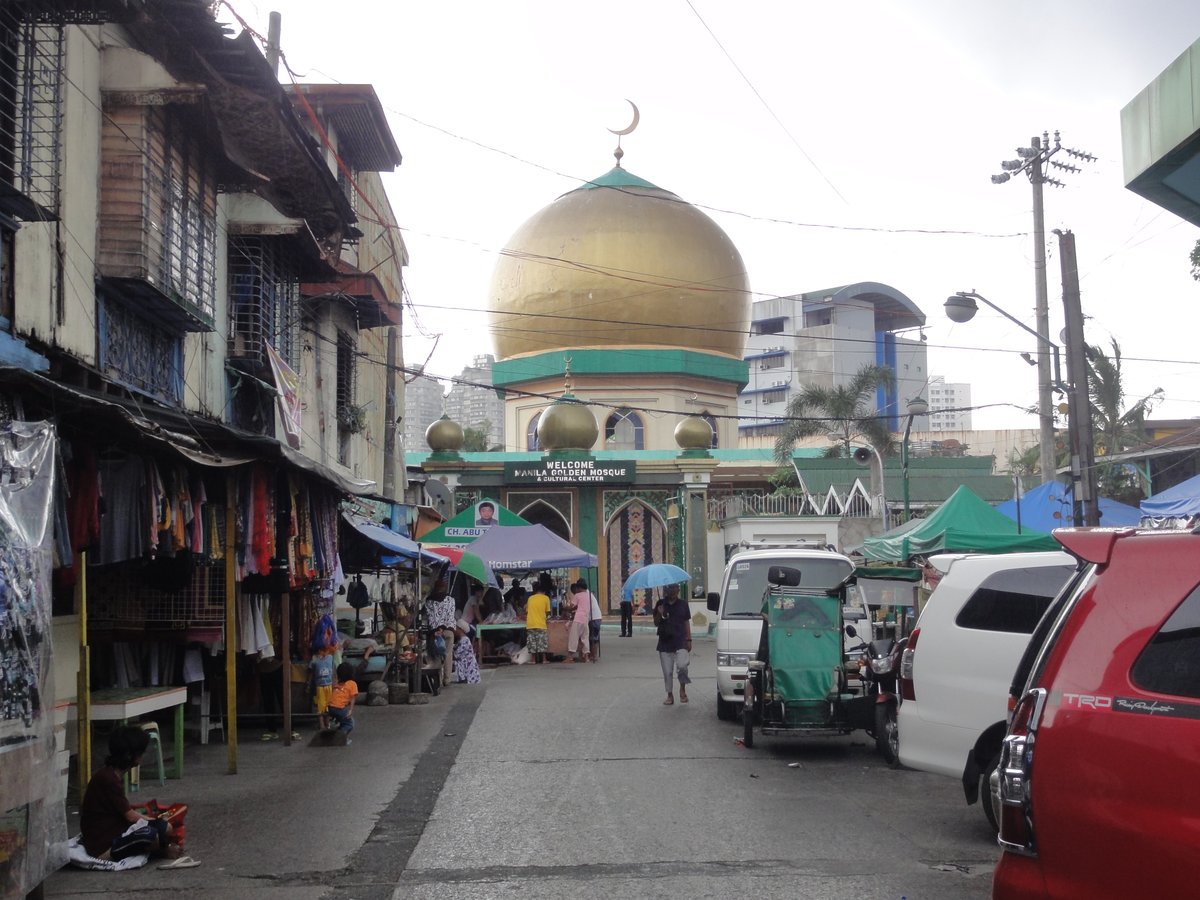 Golden Mosque in Quiapo, Manila with intricate Islamic architecture and blue sky