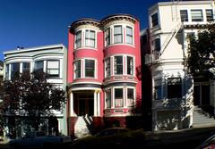 Painted Ladies Victorian houses in San Francisco with city skyline