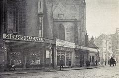 Amsterdam De Nieuwe Kerk on the Dam with shops at its base including a cigar shop, 1908