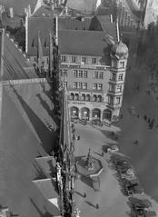 View of Dresdner Bank building and Fishbrunnen fountain from the tower of Neues Rathaus in Munich, Germany, March 1935