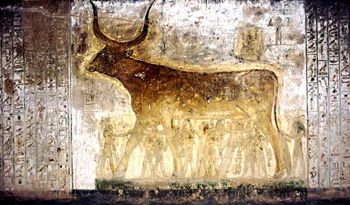 Ancient Egyptian scene from the Book of the Heavenly Cow showing sky goddess Nut in bovine form supported by god Shu and eight Ogdoad gods with the sun god sailing across her belly