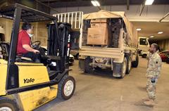 Pennsylvania National Guard members unloading Light Medium Tactical Vehicle with special needs cots at FEMA field hospital in Philadelphia