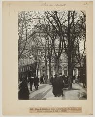 Historic black and white photograph of Place du Châtelet in Paris during winter with the Chambre des notaires visible through trees