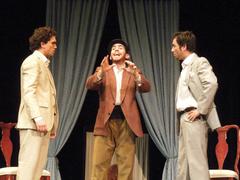 Actors performing on stage in a theater production of Cambalache and ESAD de Murcia's El Secreto a Voces