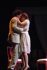 Actors performing on stage in a theatrical play