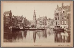 View of Amstel River from Halvemaansbrug to Muntplein with Munttoren Tower and historic English Houses background, Amsterdam 1867-1877