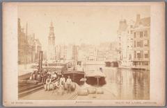 View of Amstel River from Halvemaansbrug towards Muntplein with Munttoren tower in the background and the tower of hotel Rondeel on the right after expansion in 1883