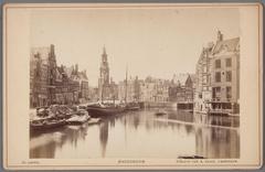 View of the Amstel River from Halvemaansbrug towards Muntplein and Munttoren in Amsterdam