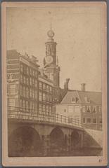 View of Muntplein from Oude Turfmarkt towards Engelse Huizen and Munttoren with De Munt coffeehouse on the right, houses demolished in 1877 named after builder John Jorden, and Doelenbrug in foreground left, Amsterdam, 1868-1876