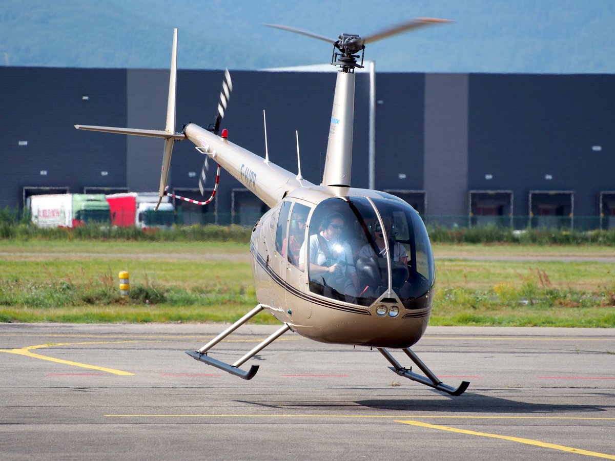Robinson R44 Raven II helicopter taking off at Colmar - Houssen Airport in France