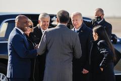 President Joe Biden disembarking Air Force One and greeting Missouri officials at Kansas City International Airport