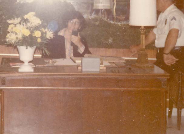 Ben Novack Jr on duty as Assistant Director of Security at hotel lobby desk in Fontainebleau Hotel Miami Beach